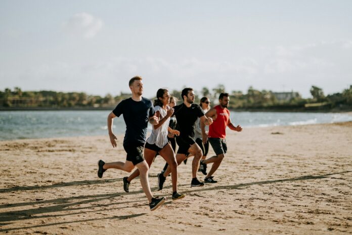 Photo by Unsplash men and women running on sea shore